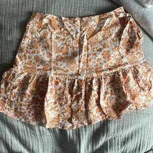 Orang and white floral skirt